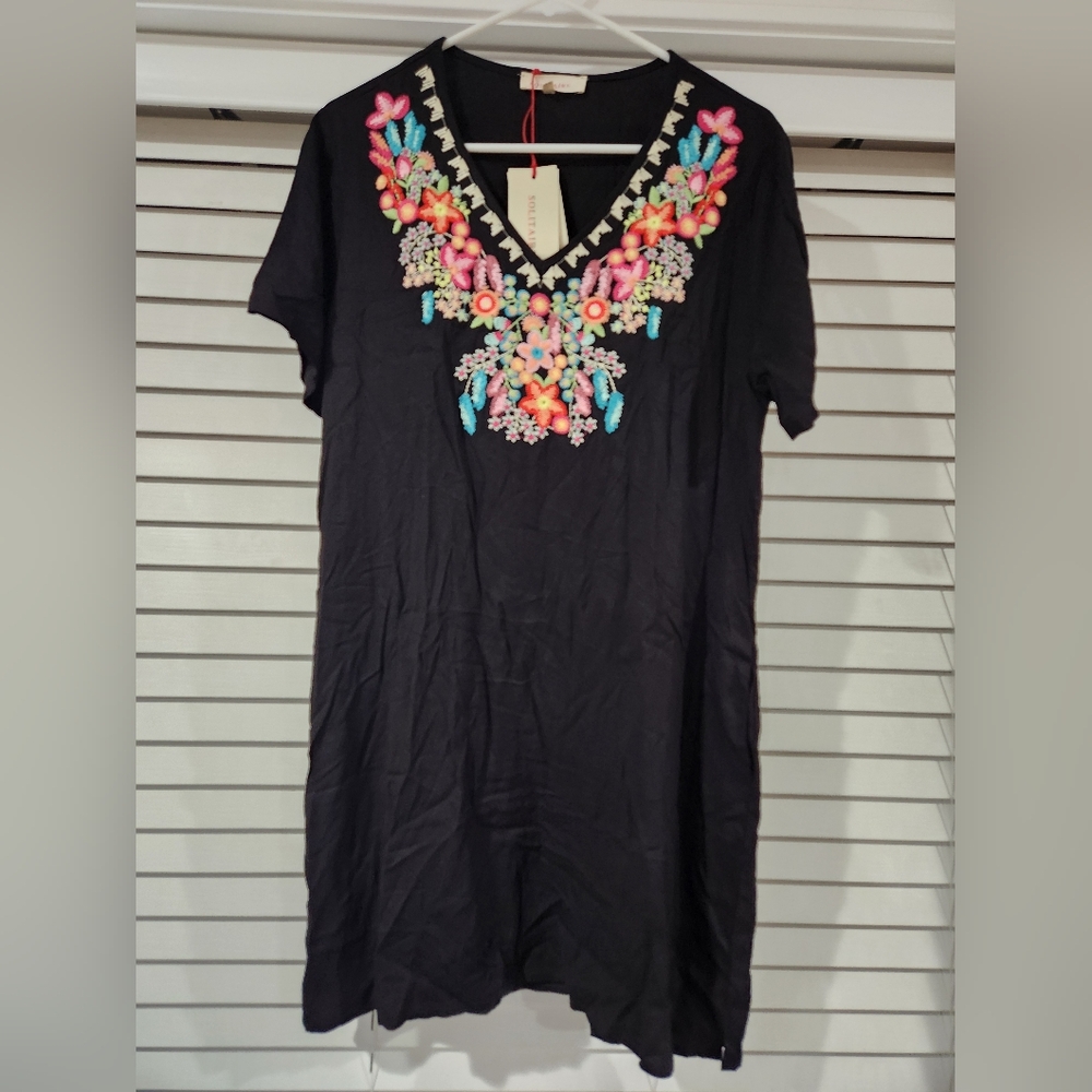 Brand new with tags tshirt dress with small side slit.